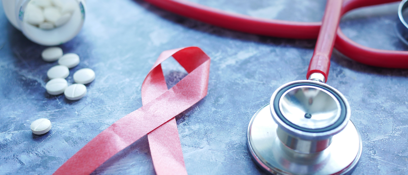 Stock image of stethoscope and red HIV ribbon